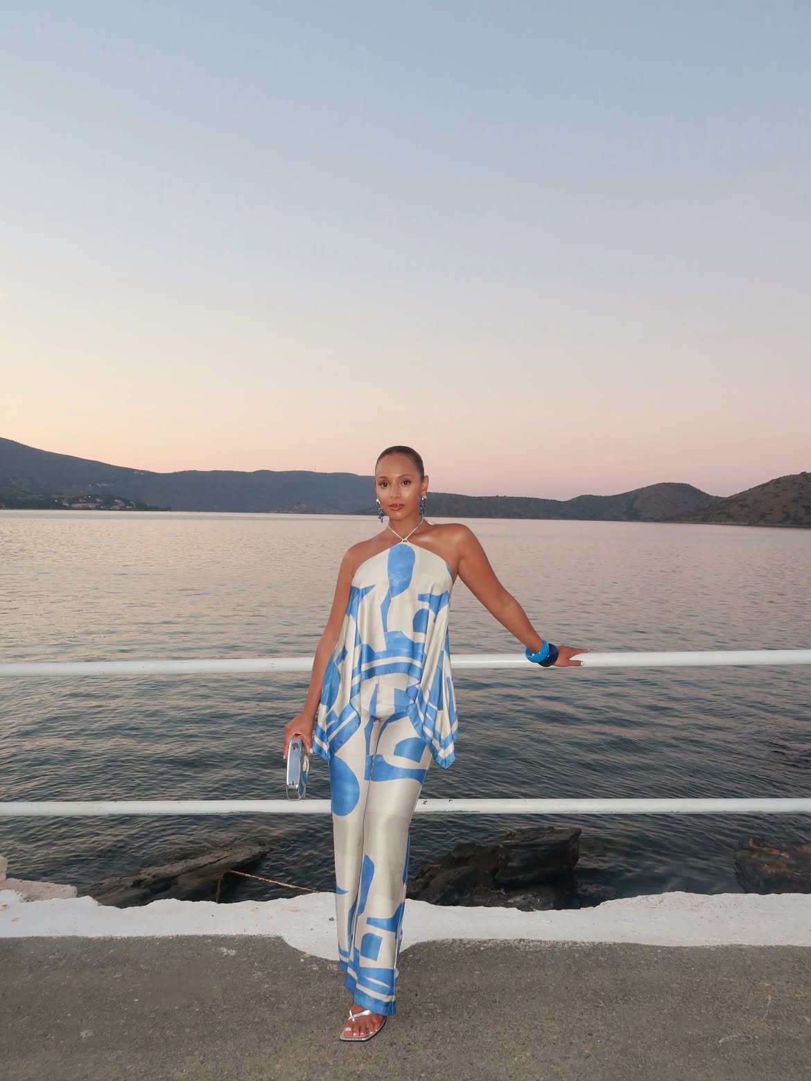 woman wearing blue and white coordinating matching pants set