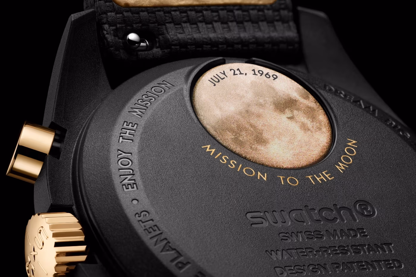 Swatch MoonSwatch 1969 battery cover engraved golden Moon and footprint Apollo 11 landing site detail