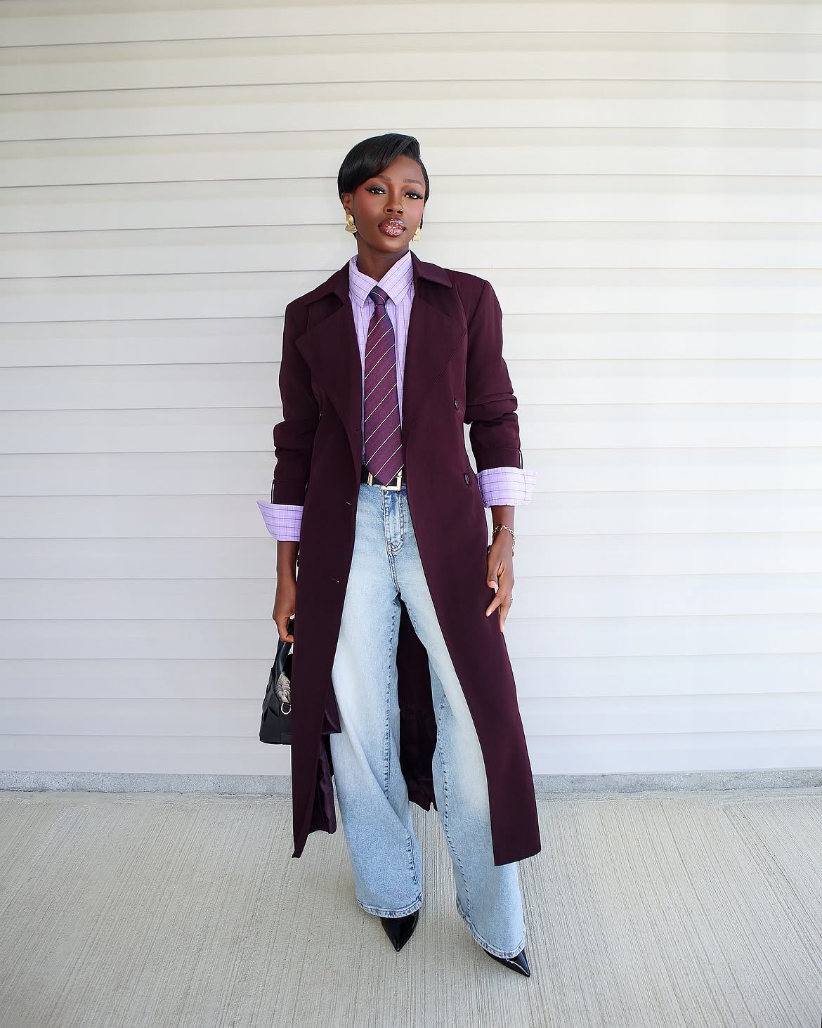 woman wearing plum royal purple coat with jeans for fall